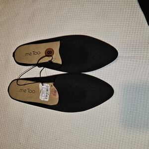 black "me Too" brand pointed-toe flat mules. 